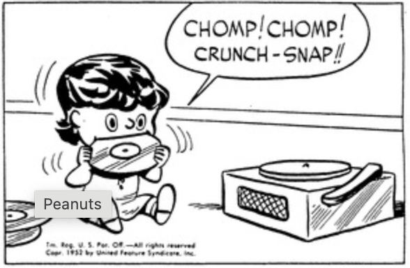 Baby Lucy is biting a record enthusiastically. "Chomp! Chomp! Crunch-snap!!"