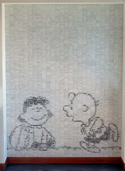 A huge mosaic at the Schulz Museum. The wall is covered with tiles, each containing one Peanuts strip; the patterns of black and white have been arranged so that, from a distance, you see a much larger image of Lucy holding the football as Charlie Brown runs up to kick it.